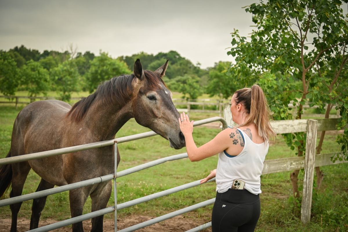 A quiet moment with one of the horses at the fence line