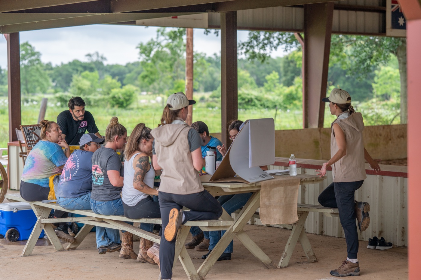 A group at the picnic tables under the pavilion